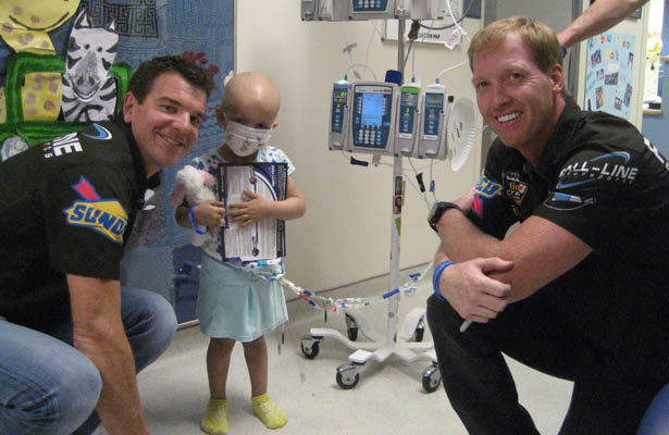 Carter and Plumb visiting children battling cancer at hospital